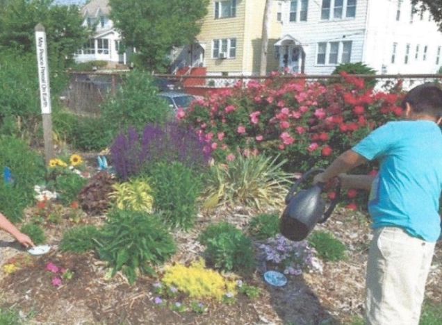 A child watering flowers